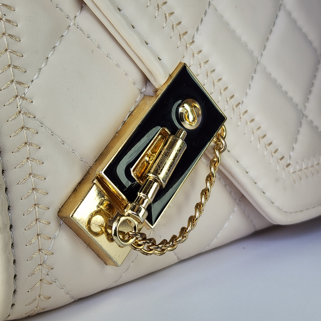 The Ivory Pearl Statement Bag – Chic & Quilted