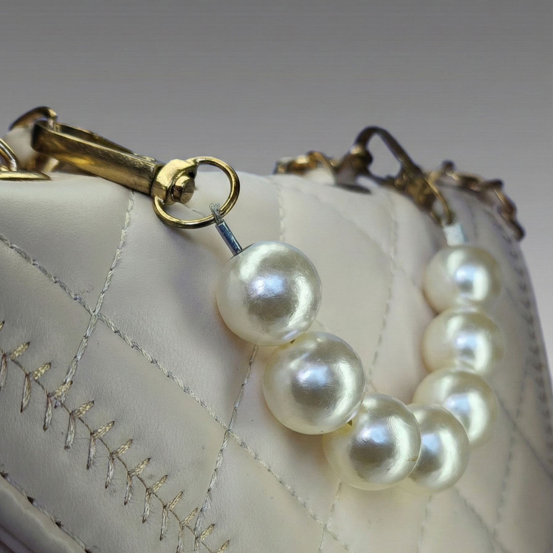 The Ivory Pearl Statement Bag – Chic & Quilted