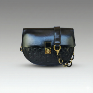 the noir monogram saddle bag – edgy & bold