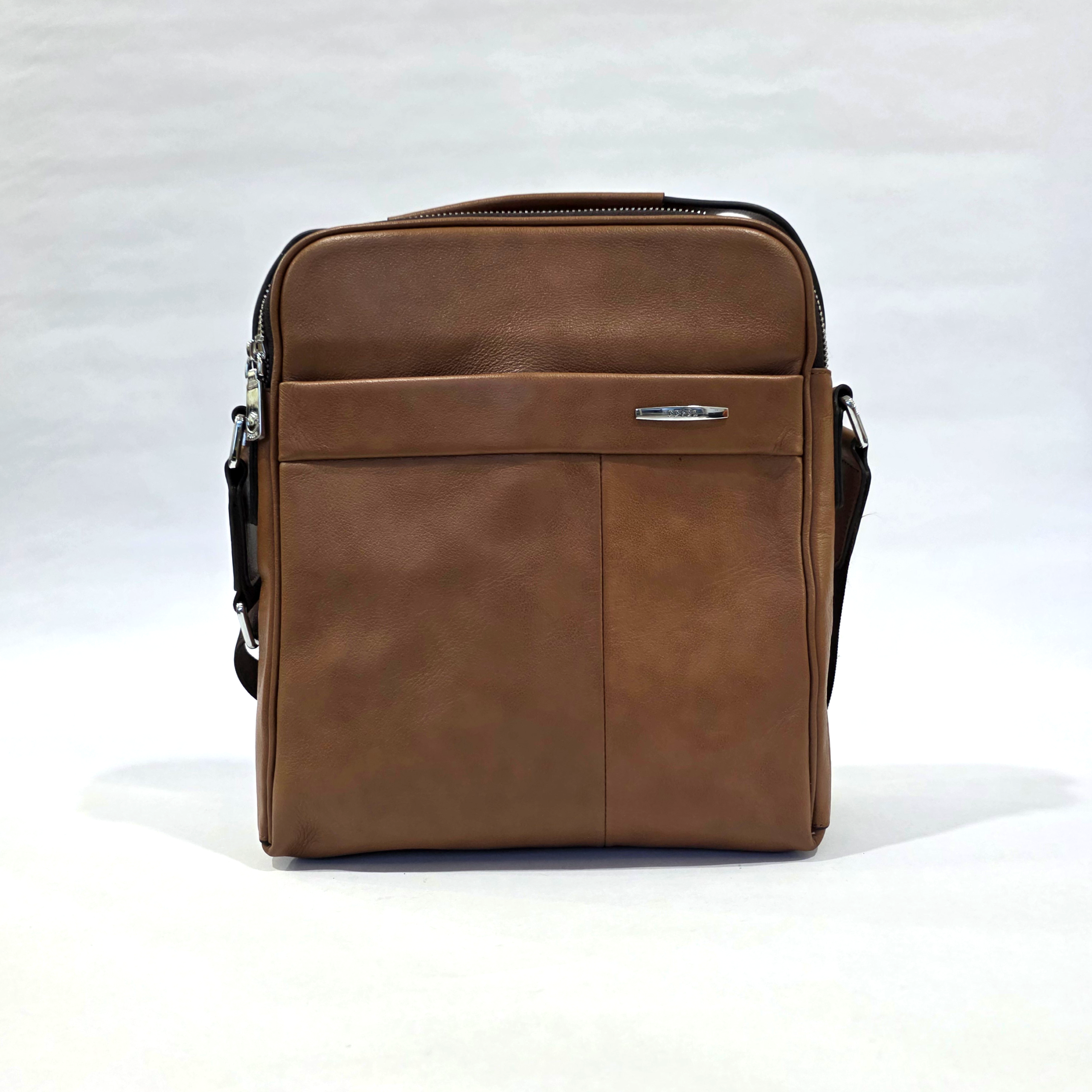 Pre-Loved FEGER Brown Textured Vertical Messenger Crossbody Bag Pre-loved FEGER brown textured vertical messenger crossbody bag with silver-tone hardware and front slip pocket.