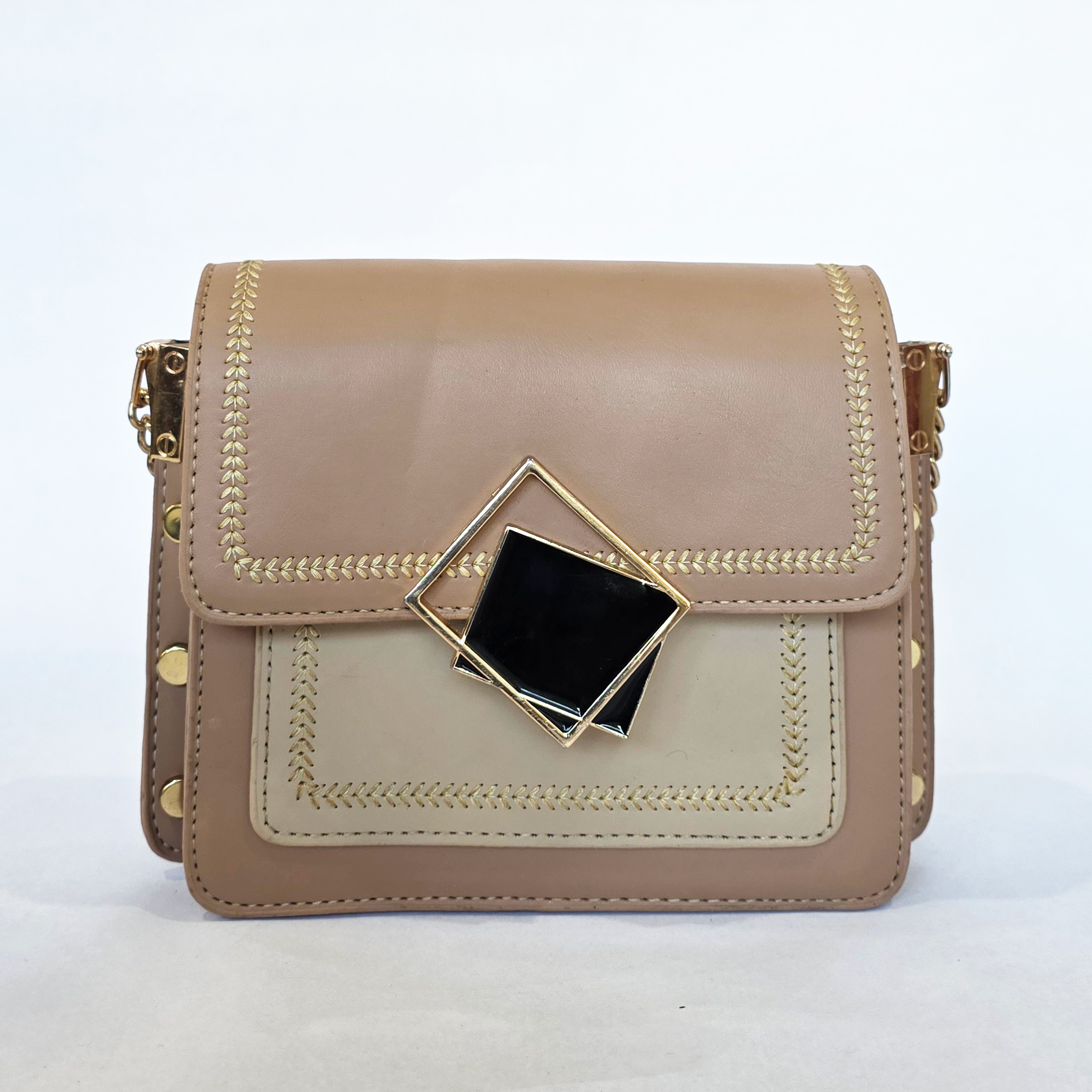 auto draft Pre-loved two-tone tan and cream flap bag featuring gold chevron embroidery and a black geometric front clasp.