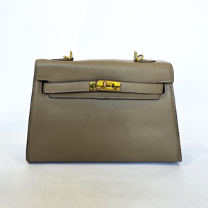 Pre-loved taupe structured bag featuring a cross-hatch saffiano texture and gold strap-and-turn-lock closure.