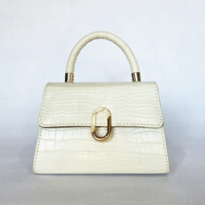 Pre-loved cream mock-croc mini top-handle bag featuring a gold and resin oval statement clasp.